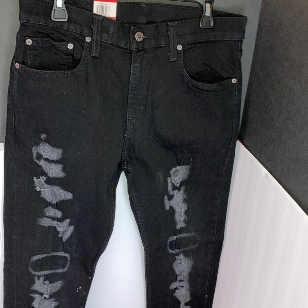 Black Levi’s distressed denim